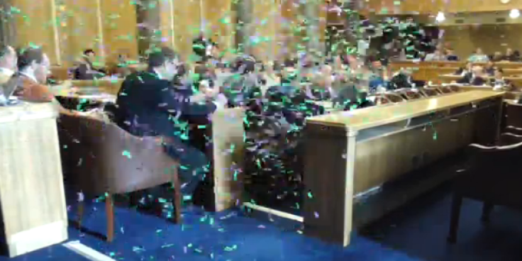 Protesters released confetti at the council meeting
