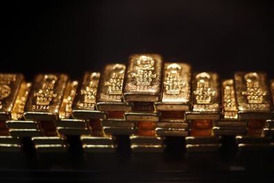 Gold touches new high amid financial uncertainty, a lower dollar and tumbling stock prices