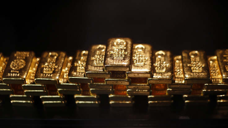 Gold touches new high amid financial uncertainty, a lower dollar and tumbling stock prices
