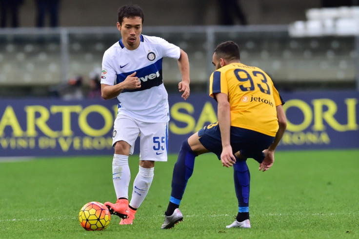 Inter Milan's defender from Japan Yuto Nagatomo (L) fights for the ball with Hellas Verona's midfielder from France Mohamed Fares during the Italian Serie A football match Verona vs Inter Milan at the Bentegodi Stadium in Verona on Febrauary 7, 2016