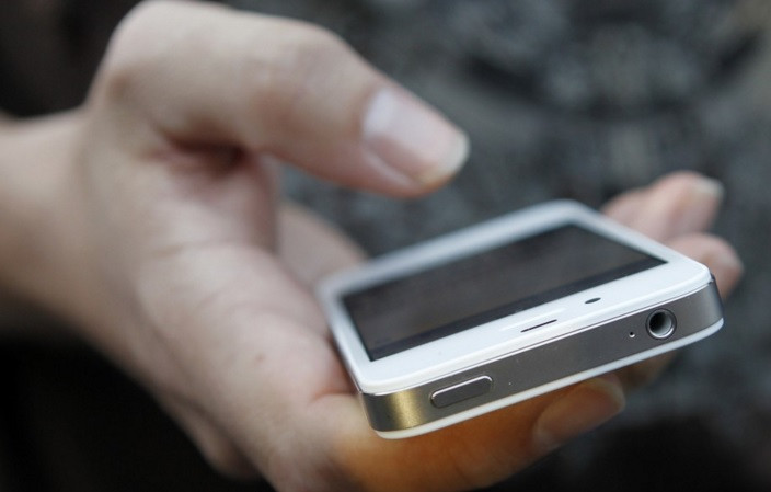 holding iphone holding iphone