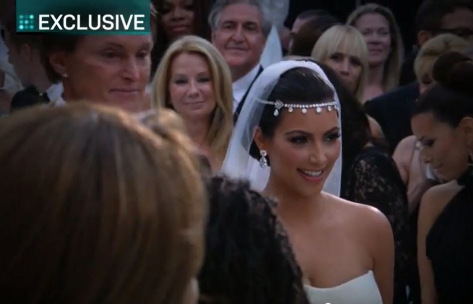 Bruce Jenner, Kardashians step father,  is walking Kim down the aisle.