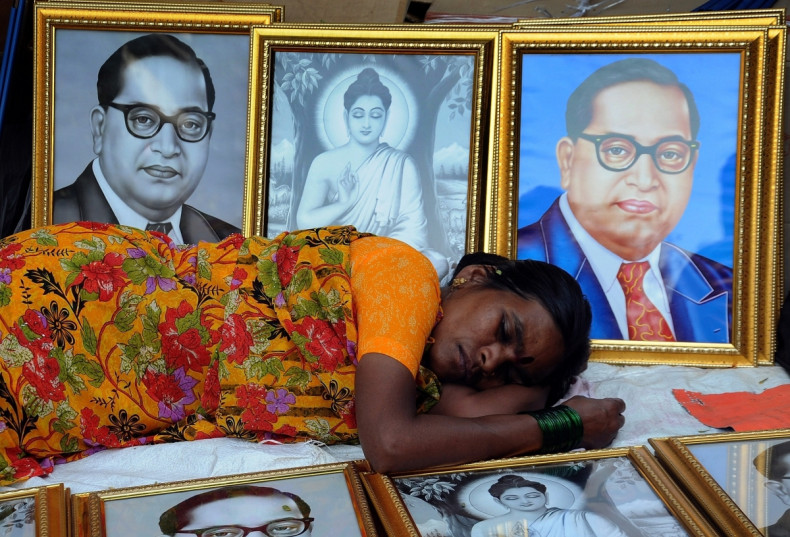 Woman sleeps among Ambedkar picture