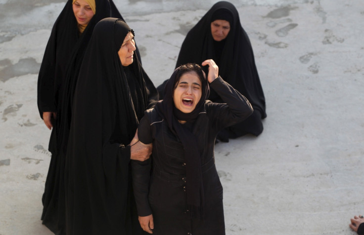 A woman reacts during a funeral