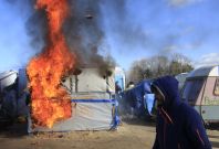 Calais jungle in flames