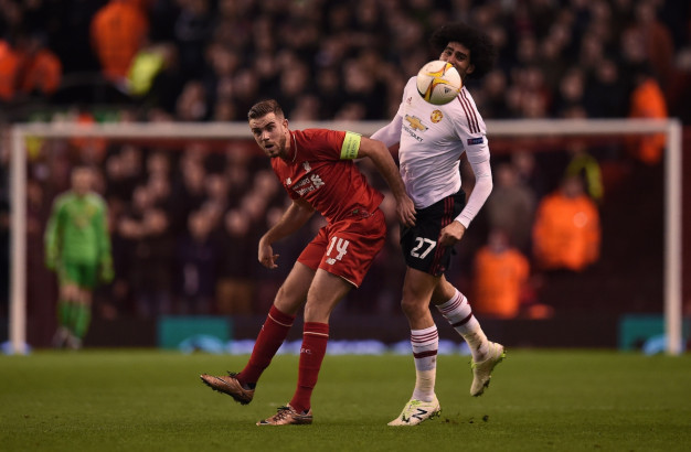 Jordan Henderson fights to win the ball Jordan Henderson fights to win the ball