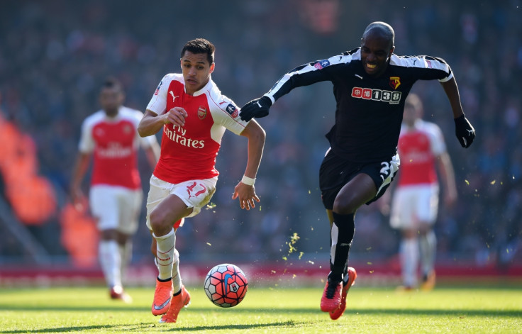 Alexis Sanchez (left) chases the ball