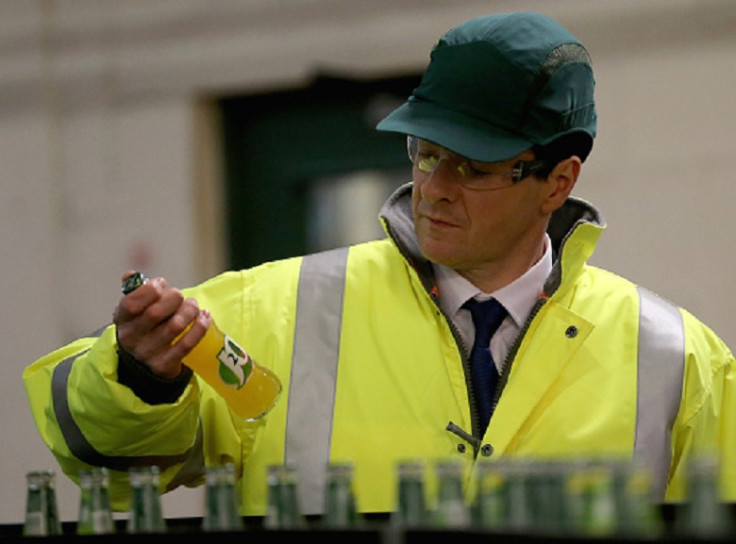 George Osborne holds a soft drink