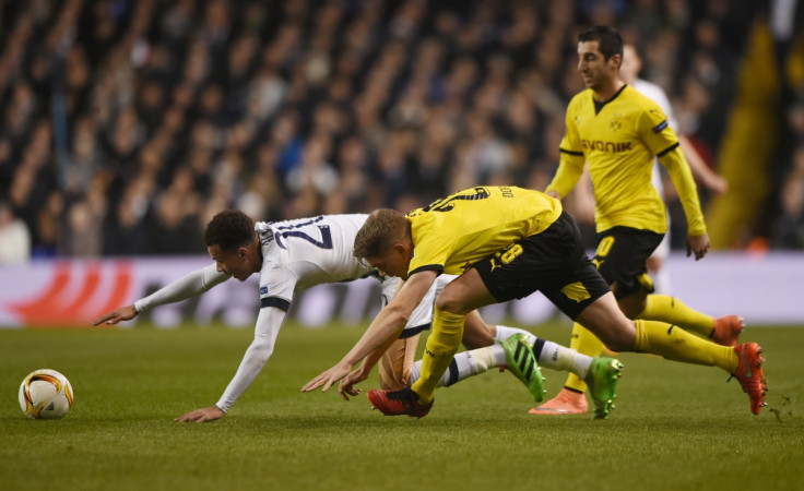 Dele Alli falls to the ground