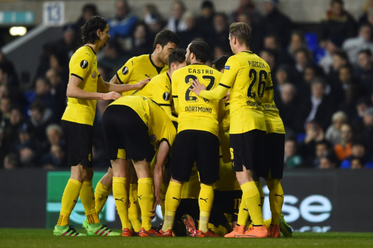 Dortmund players celebrate at the Lane
