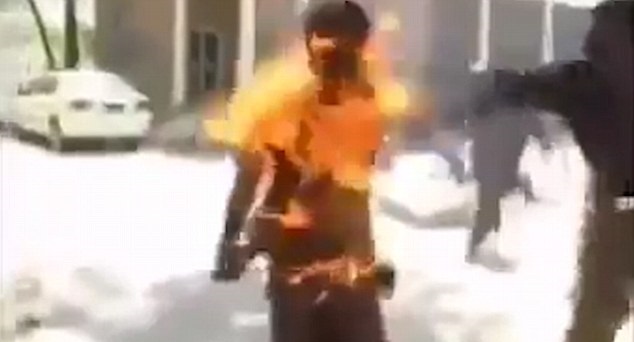 Man erupts into flames Man erupts into flames