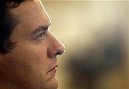 Chancellor George Osborne listens to David Cameron