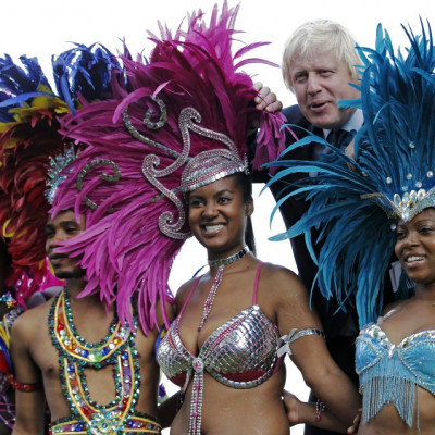 London Mayor Boris Johnson joins dancers for a photocall to promote the Notting Hill Carnival at City Hall in London