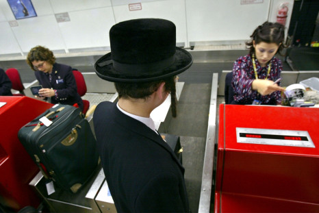 An ultra-Orthodox man boarda a flight in