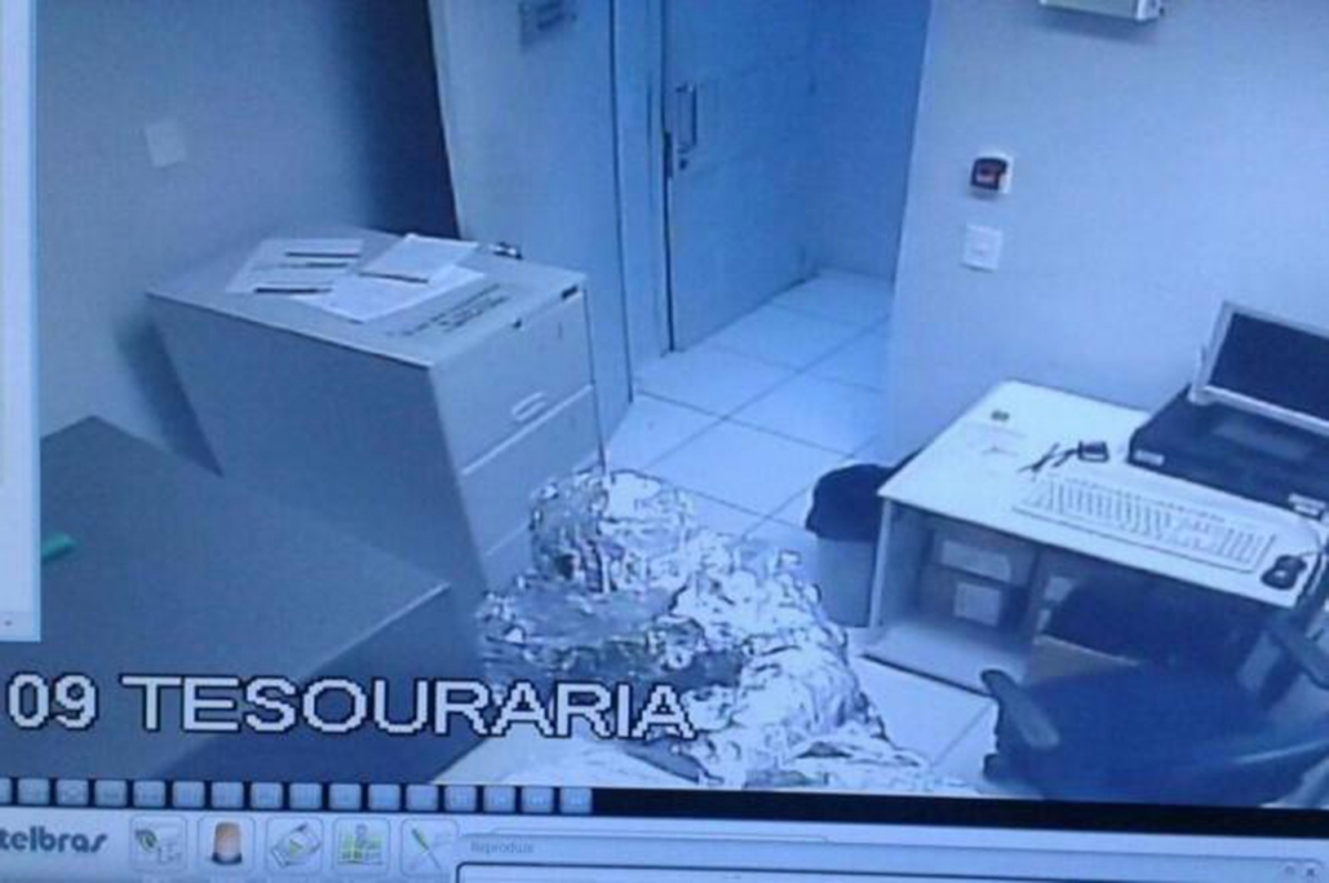 Foil covered bank robber on CCTV Foil covered bank robber on CCTV