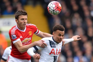 Michael Carrick (left) in action against Spurs