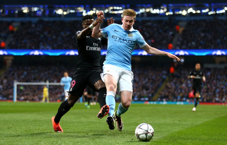 Kevin de Bruyne (right) wins the ball