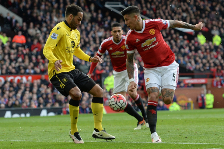 Marcus Rojo challenges for the ball