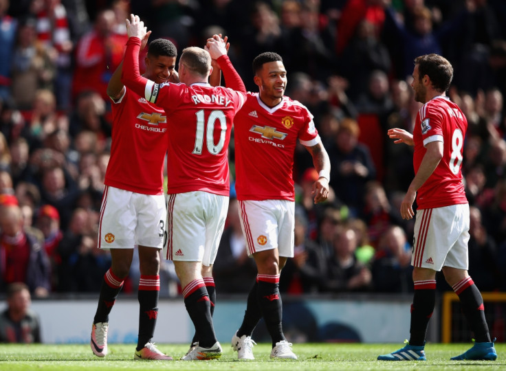 Marcus Rashford celebrates with Wayne Rooney