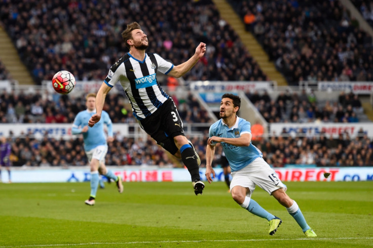 Jesus Navas (right) chases after the ball