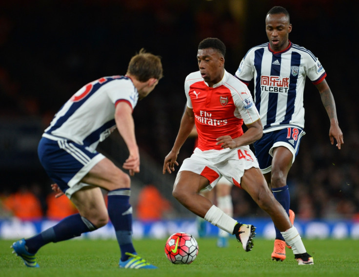 Alex Iwobi dribbles with the ball