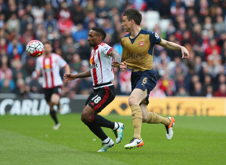 Laurent Koscielny (right) scraps for the ball
