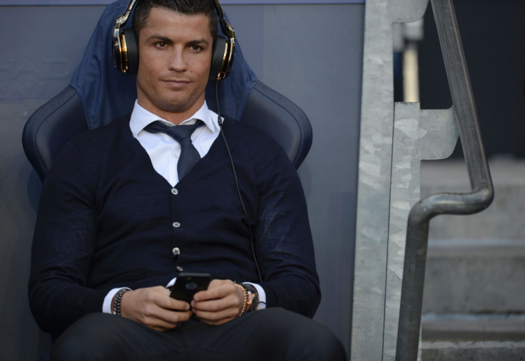 Ronaldo watches from the bench