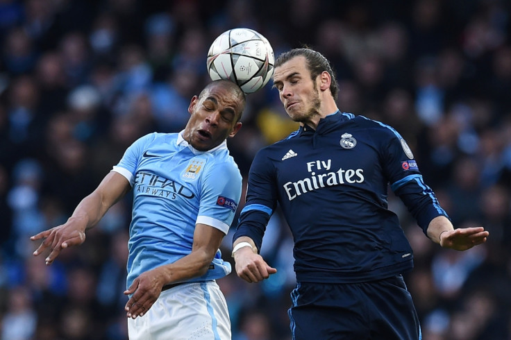 Bale (right) tries to win the ball
