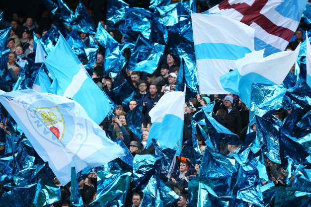 City fans cheer their team on City fans cheer their team on