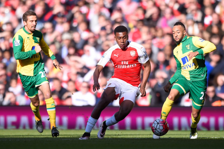 Alex Iwobi battles for the ball