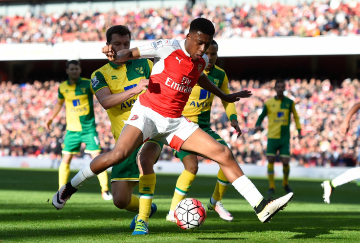 Alex Iwobi dribbles with the ball