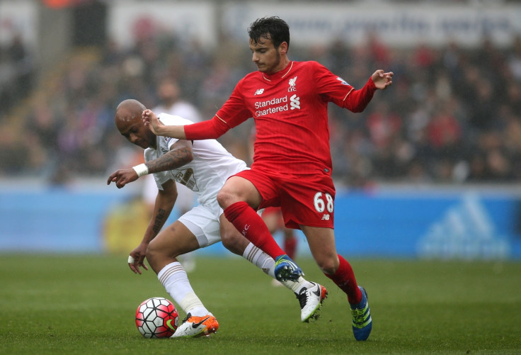 Ayew competes for the ball