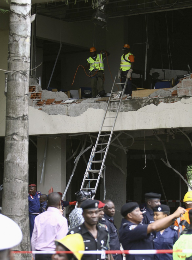 U.N. staff are seen after a bomb blast that ripped through the United Nations offices in the Nigerian capital of Abuja U.N. staff are seen after a bomb blast that ripped through the United Nations offices in the Nigerian capital of Abuja