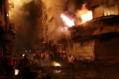 Egyptian firefighters extinguish fire at the popular market area of al-Atabaa in downtown Cairo