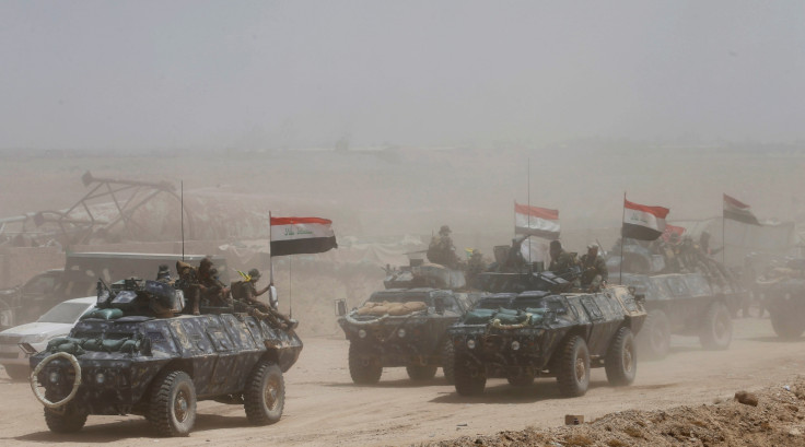 Iraqi Shi'ite fighters with police
