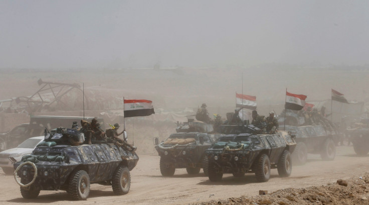 Iraqi Shi'ite fighters with police