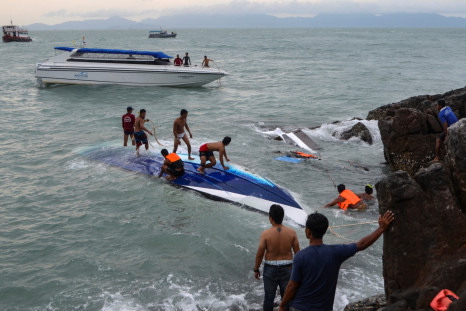 Rescue workers search for victims after a speedboat crashed