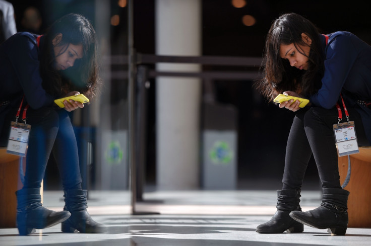 Woman uses mobile phone