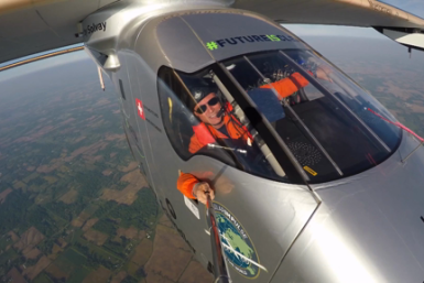 Solar implulse pilot takes a selfie from the cockpit