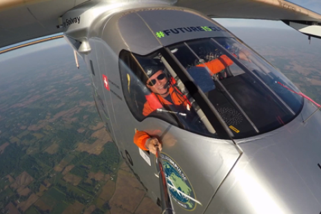 Solar implulse pilot takes a selfie from the cockpit