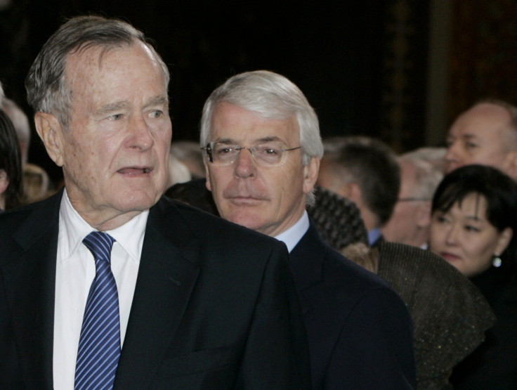 Former U.S. President George Bush (L) and former British Prime Minister Sir John Major