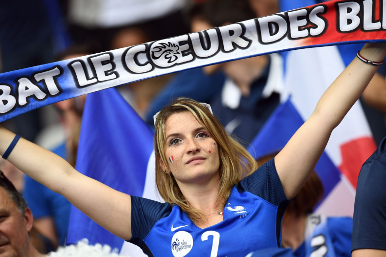 A French fan cheers her team on