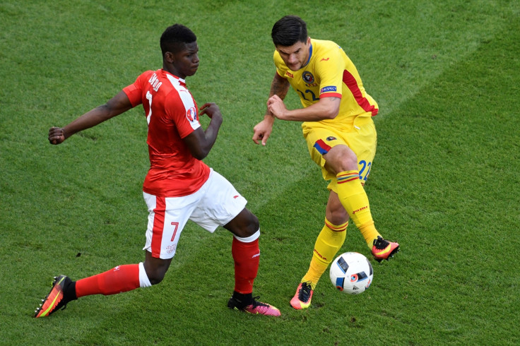 Embolo challenges for the ball