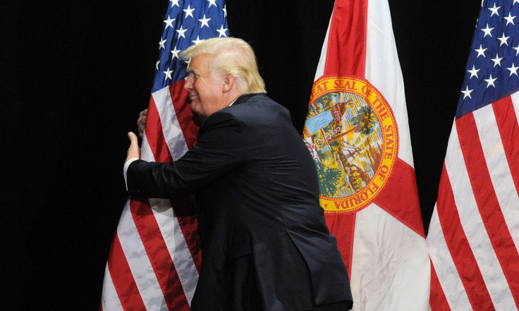 Donald Trump hugging a flag