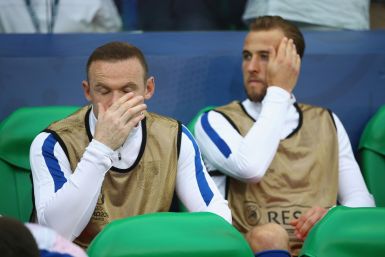 Wayne Rooney and Harry Kane watch on