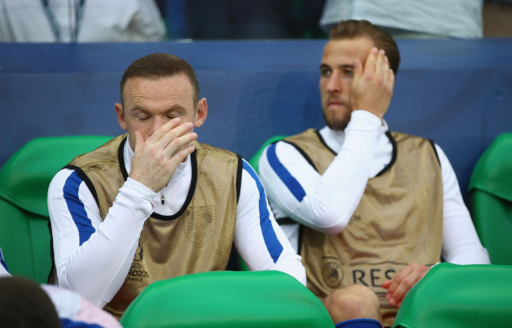 Wayne Rooney and Harry Kane watch on