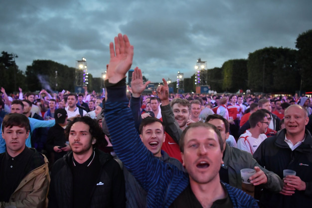 Supporters watching the game in the fanzone Supporters watching the game in the fanzone