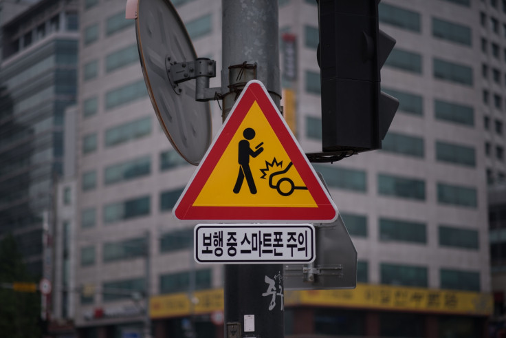 Warning sign for texting pedestrians