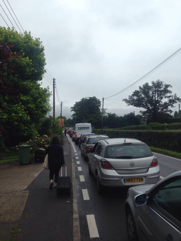 Walking past the Glastonbury traffic Walking past the Glastonbury traffic