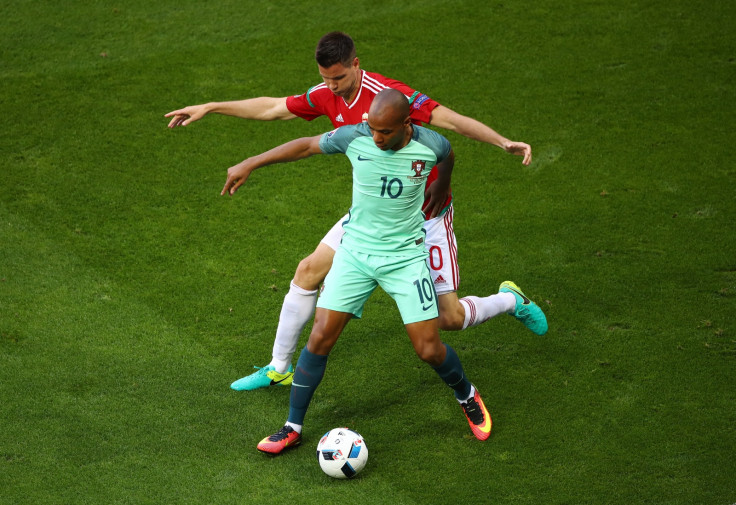 Joao Mario protects the ball